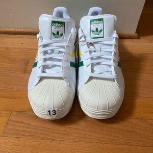 Adidas White Golf Sneakers with Green and Yellow Stripes